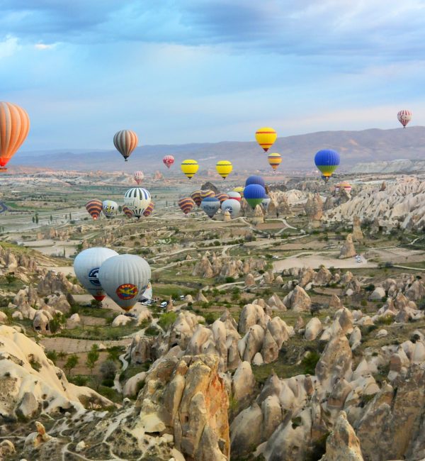 photo of assorted-color air balloon lot in mid air during daytime